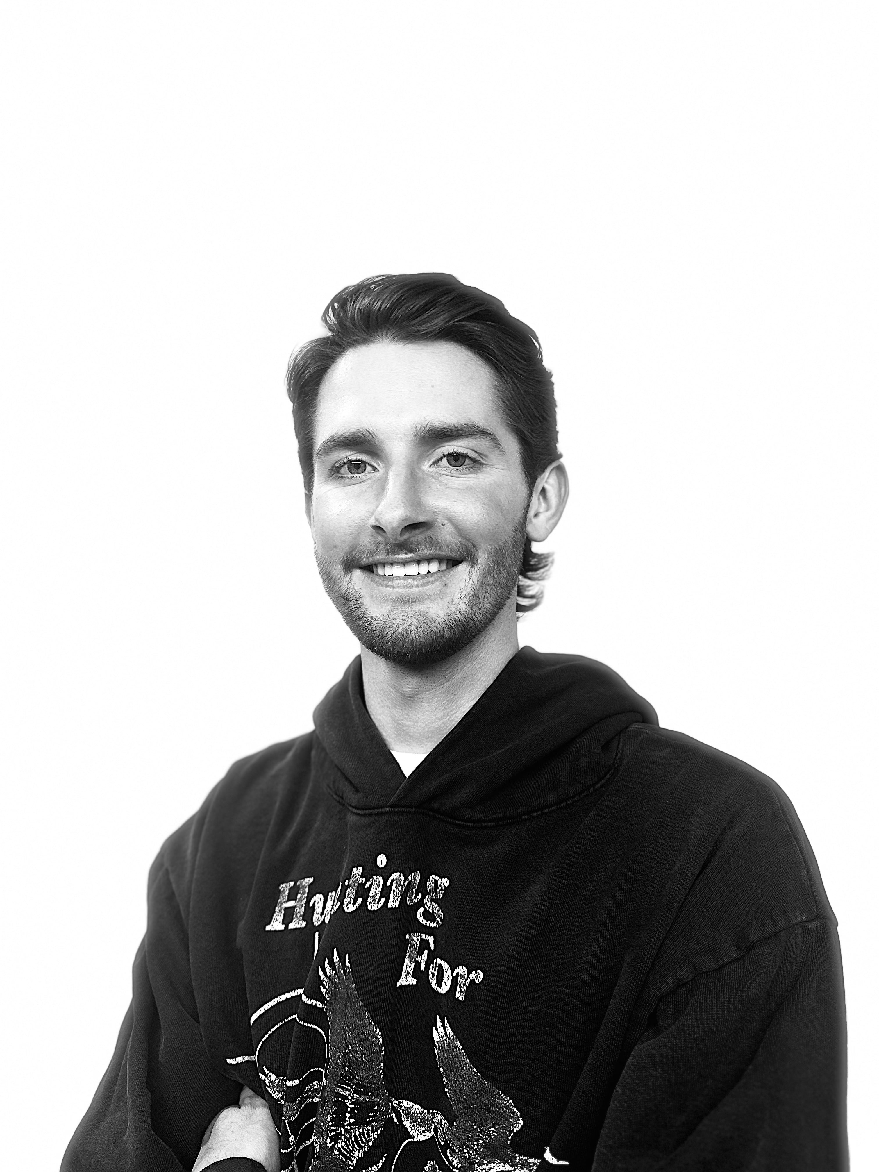Headshot of Adley Prescot, barber and stylist with The Bureau Barbershop in Salt Lake City.